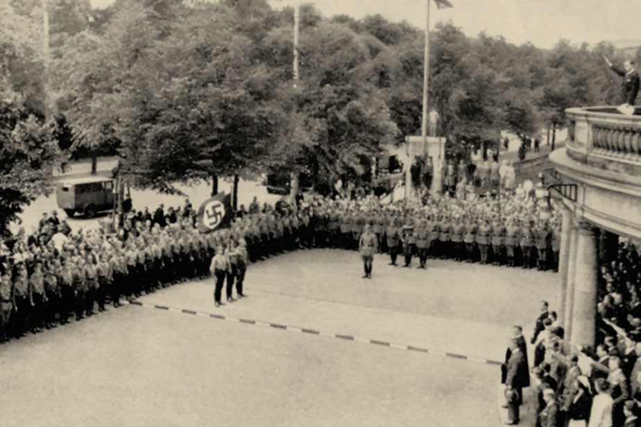 A student rally with a swastika flag in front of the Main Building in 1933