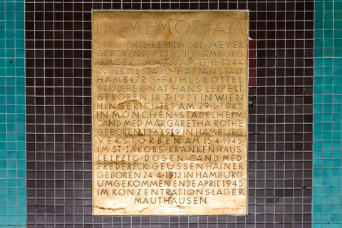 The plaque in the photo is embedded in the Audimax floor and memorializes the members of the White Rose who were murdered by the Nazis.