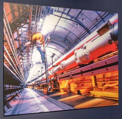This is a photo from the HERA tunnel at DESY. The accelerator tube runs from the right to the center. In the middle of the picture, a person is climbing a ladder.